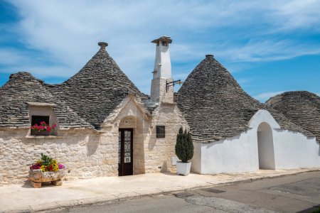 Photo for The famous white Trullo houses with stone roofs in the village of Alberobello - Royalty Free Image