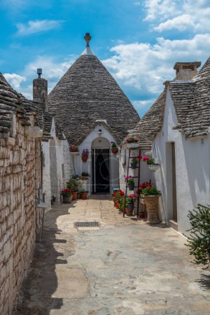 Photo for Alberobello - beautiful street leading to the house - Royalty Free Image