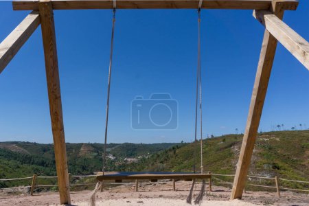 Photo for Wooden swing perspective on the mountain - Royalty Free Image