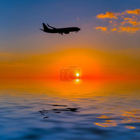 aircraft silhouette flying over water at the sunset, air transportation background