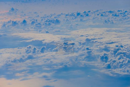 Photo for View from the airplane vindow to earth covered by clouds - Royalty Free Image