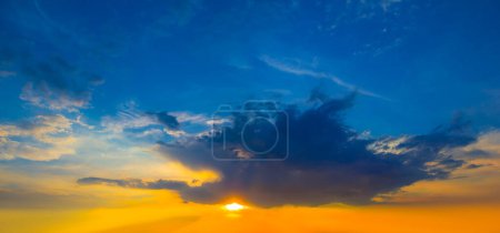 Photo for Evening sun on dramatic sky  background - Royalty Free Image