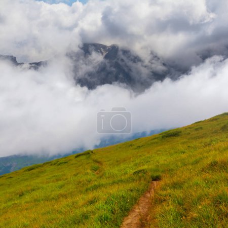 Photo for Mountain valley  in dense mist and clouds - Royalty Free Image