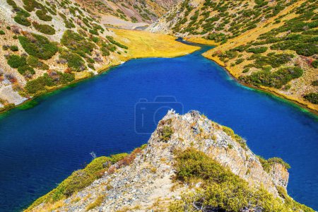 Photo for Mountain lake Koksay in the Aksu-Zhabagly Nature Reserve. Lake Koksay located in the Tien Shan mountains in the southern Kazakhstan. Aksu-Zhabagly is the oldest nature reserve in Central Asia - Royalty Free Image