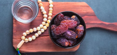 Photo for Dried delicious date fruit on vintage stone background - Royalty Free Image