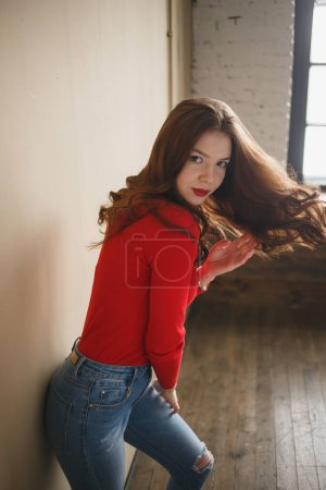 Photo for Close up young attractive woman 20s in red turtleneck isolated on plain pastel beige background studio. People lifestyle concept - Royalty Free Image