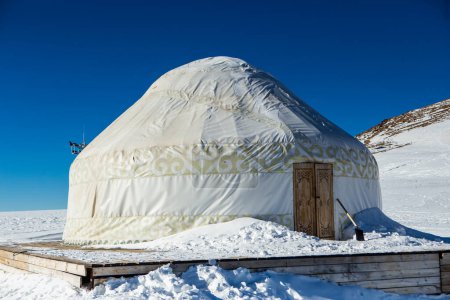 Photo for Kazakh yurt in the mountains near Almaty in the snow in winter. House of nomadic peoples in the mountains in winter. - Royalty Free Image
