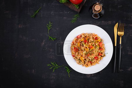 Photo for Tomato rice with vegetables and chicken. Healthy food. Healthy lifestyle. Top view, overhead - Royalty Free Image
