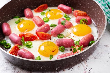 Photo for Homemade delicious american breakfast with  fried eggs,  sausages, and tomatoes. Concept of a healthy lifestyle - Royalty Free Image