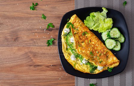 Photo for Omelette with mozzarella cheese and avocado. Ketogenic, keto diet breakfast. Top view, copy space - Royalty Free Image