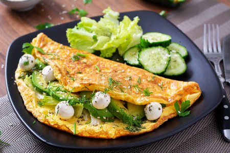 Photo for Omelette with mozzarella cheese and avocado. Ketogenic, keto diet breakfast. - Royalty Free Image