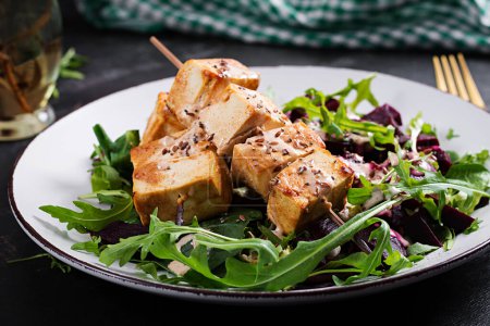Photo for Baked tofu skewers in sauce and beet salad, arugula with vegetable yogurt sauce. Healthy vegan food concept. Healthy food. - Royalty Free Image