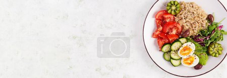 Photo for Breakfast oatmeal porridge with boiled eggs, fresh salad and kiwi. Healthy balanced food. Top view, banner - Royalty Free Image