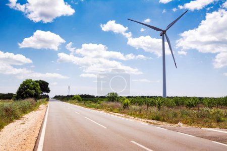 Photo for Wind turbine farm across a road on the Bulgaria. - Royalty Free Image