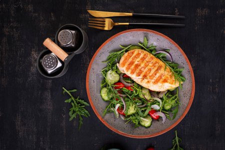 Photo for Grilled chicken fillet and fresh salad. Healthy lunch menu. Keto food. Top view - Royalty Free Image