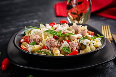 Photo for Pasta with tuna, tomatoes and feta cheese. Pasta salad with tuna. Healthy italian food. Healthy dinner. - Royalty Free Image