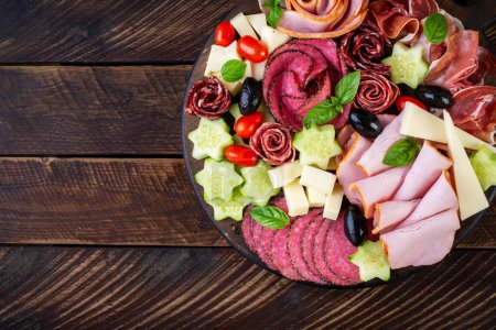 Photo for Colorful charcuterie boards and boxes vegetables, meat and cheese.  Assortment of tasty appetizers or antipasti. Top view. Copy space - Royalty Free Image