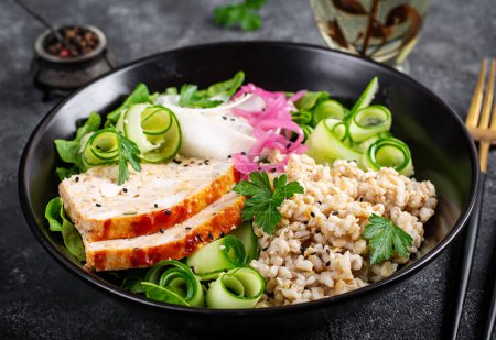 Photo for Brunch or lunch. Plate with oatmeal, chicken meatloaf, cucumber and green herbs. Health food. - Royalty Free Image