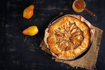 Photo for Galette with pear and blue cheese dipped in honey. Healthy eating. Top view - Royalty Free Image