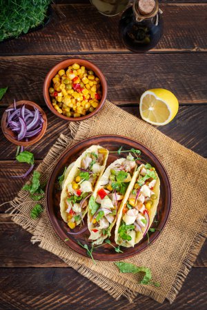 Photo for Mexican tacos with chicken meat, corn and salsa. Healthy tacos. Diet menu. Mexican taco. Top view, flat lay - Royalty Free Image