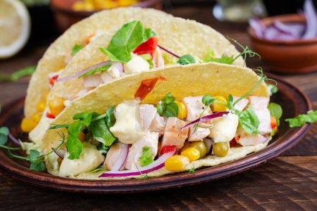 Photo for Mexican tacos with chicken meat, corn and salsa. Healthy tacos. Diet menu. Mexican taco. - Royalty Free Image