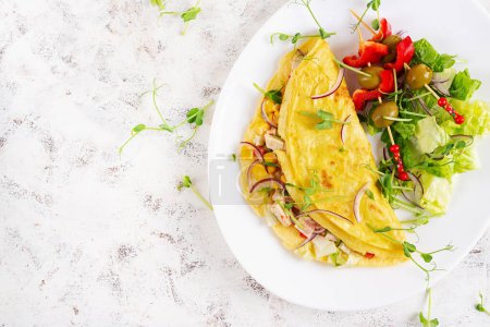 Photo for Healthy breakfast.Quesadilla with omelette, chicken fillet, corn and fresh salad. Keto, ketogenic lunch. Top view - Royalty Free Image