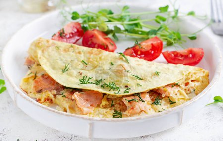 Photo for Healthy breakfast. Quesadilla with omelette, salmon  and sliced tomatoes. Keto, ketogenic lunch. - Royalty Free Image