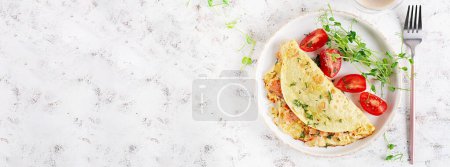 Photo for Healthy breakfast. Quesadilla with omelette, salmon  and sliced tomatoes. Keto, ketogenic lunch. Top view, banner - Royalty Free Image