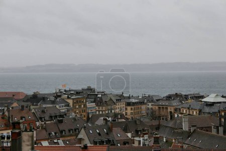 Photo for NEUCHATEL, SWITZERLAND : old town overview on a windy day in winter time - Royalty Free Image