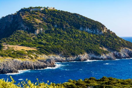 Photo for Sea and mountains panorama under the clear sky. Gialova sea, Peloponnese, Greece. Remote view of old Navarino castle. - Royalty Free Image