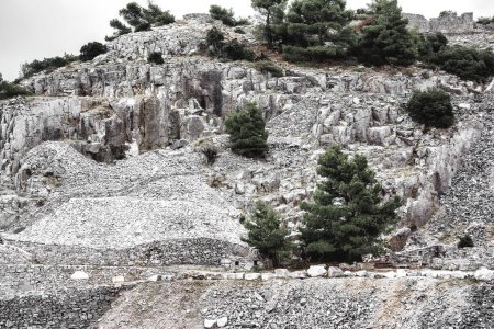 Photo for Part of an abandoned Penteli marble quarry in Attika, Greece. Penteli is a mountain, 18 km north of Athens, from which stone was supplied for the construction of the Parthenon. - Royalty Free Image