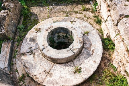 The archaeological site of Eleusis. Well of the fair dances where goddess Demeter rested, when she first came to Eleusis. Eleusinian women performed dances in honor of her. Attica, Greece.