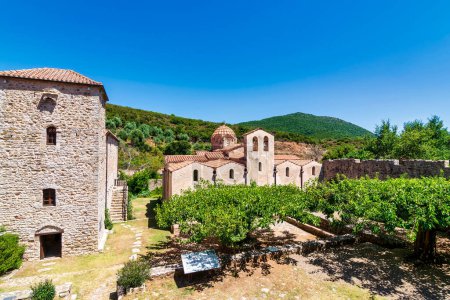Photo for View of the monastery complex of Andromonastiro in Peloponnese, Greece. A monastic complex with fortifications and defensive towers. It was abandoned for over a century but has recently been effectively renovated. - Royalty Free Image