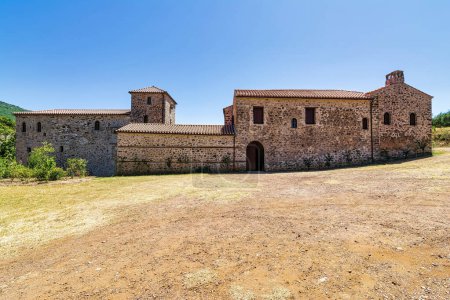 Photo for View of the monastery complex of Andromonastiro in Peloponnese, Greece. A monastic complex with fortifications and defensive towers. It was abandoned for over a century but has recently been effectively renovated. - Royalty Free Image