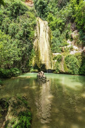 Photo for Waterfall of Kalamaris, a natural reserve in Gialova region, Messinia prefecture, Peloponnese, Greece, Europe. It is a small wetland with many amphibians and insects living in its waters. - Royalty Free Image
