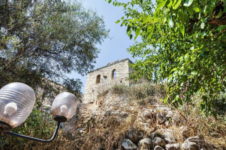 Photo for Kardamili old town, Messenia, Greece. Old Kardamili is a small collection of abandoned fortified tower-houses clustered around a beautiful 18th century church in Messenia Peloponnese Greece. - Royalty Free Image