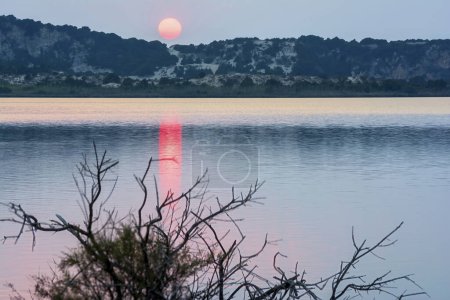 Photo for Sunset at the gialova lagoon. The gialova lagoon is one of the most important wetlands in Europe. Greece. - Royalty Free Image