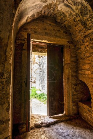 Entrance of the monastery enclosed by Davelis cave in Penteli, a mountain to the north of Athens, Greece.