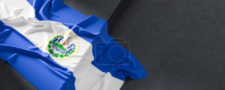 Flag of El Salvador. Fabric textured El Salvador flag isolated on dark background. 3D illustration