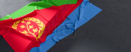 Drapeau de l'Érythrée. Tissu texturé drapeau érythréen isolé sur fond sombre. Illustration 3D