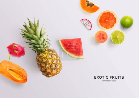 Photo for Creative layout made of papaya, pineapple, grapefruit, guava, watermelon, dragon fruit and lime. Flat lay. Food concept. - Royalty Free Image