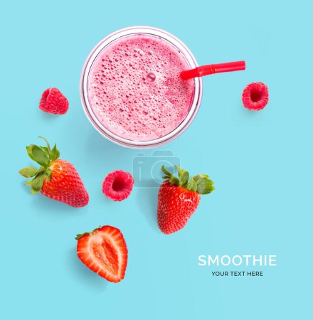 Photo for Creative layout made of raspberry, strawberry and coconut smoothie. Flat lay. Food concept. Smoothie on the blue background. - Royalty Free Image
