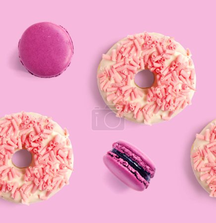 Photo for Seamless pattern made of purple macaroon and pink donut. Flat lay. Food concept. - Royalty Free Image