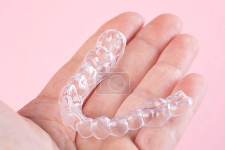 Photo for Orthodontic treatment, invisible braces, new orthodontic technology, occlusal splint - Royalty Free Image