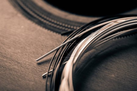Photo for Abstract new nylon core guitar strings. Restring classical guitar string concept. - Royalty Free Image