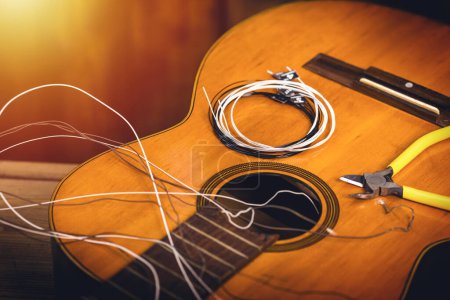 Photo for Restring classical guitar concept. Closeup at the new strings. - Royalty Free Image