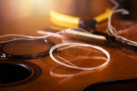 Photo for Restring classical guitar concept. Closeup at the new strings. - Royalty Free Image