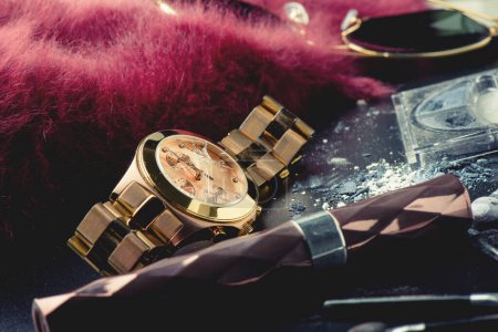 Photo for Closeup the rose gold wrist watch with cracked glass. The broken wrist watch. Concept of crime and accident. - Royalty Free Image