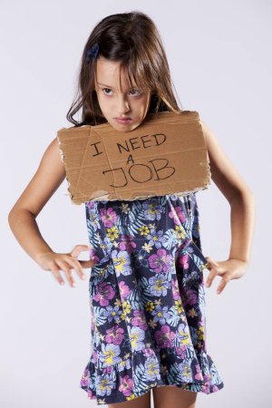Little girl holding a cardboard asking for a job