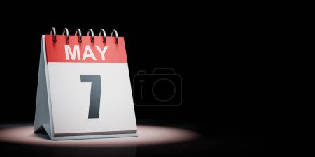 Rojo y blanco 7 de mayo Calendario de escritorio iluminado sobre fondo negro con espacio de copia Ilustración 3D